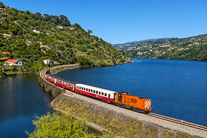 Train beside the Douro River — digitally enhanced photograph