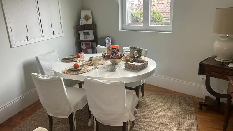 The chalet dining room, with a round table and natural light